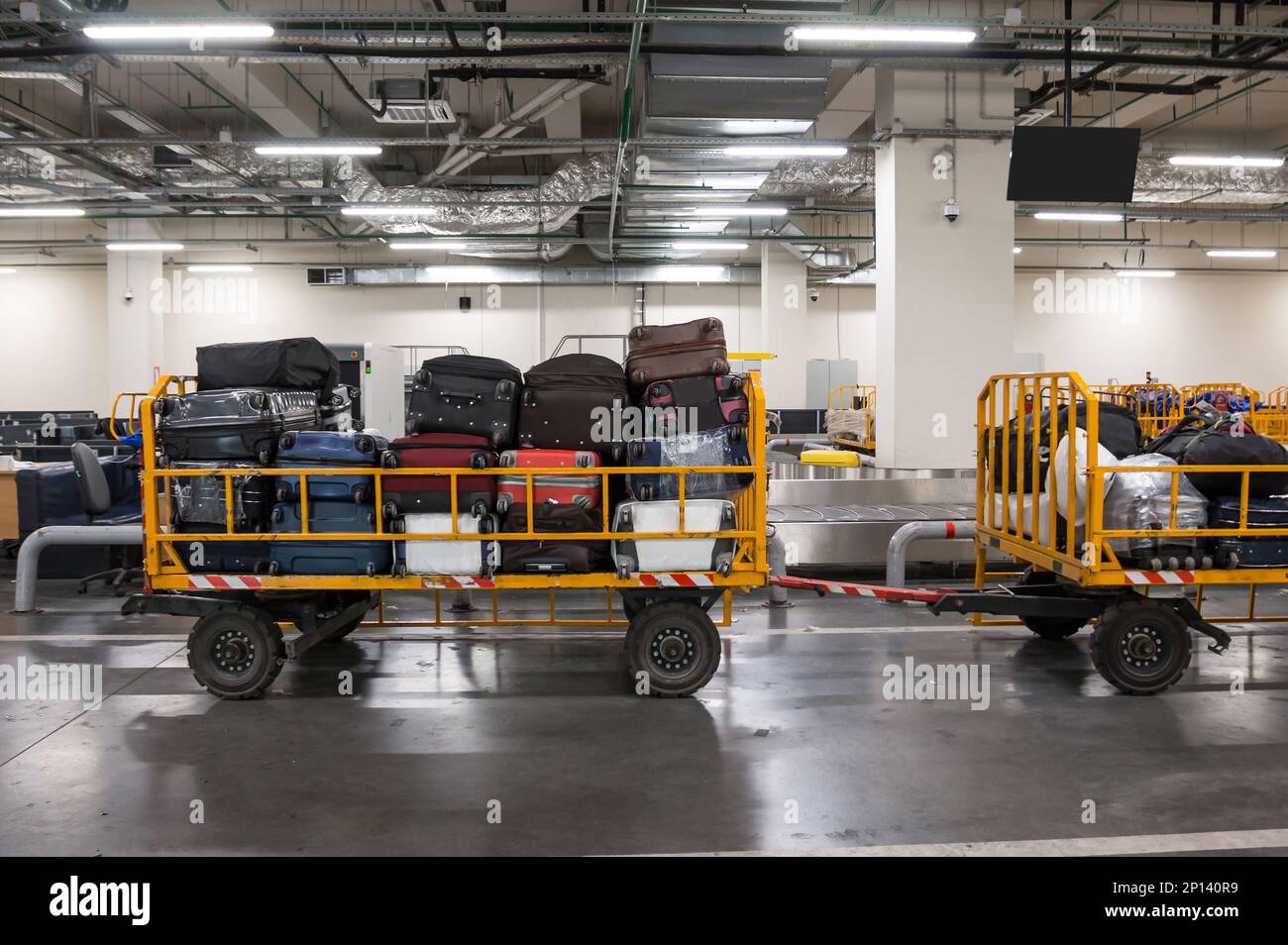 Baggage trolleys with luggage in the baggage compartment of the airport Stock Photo Alamy