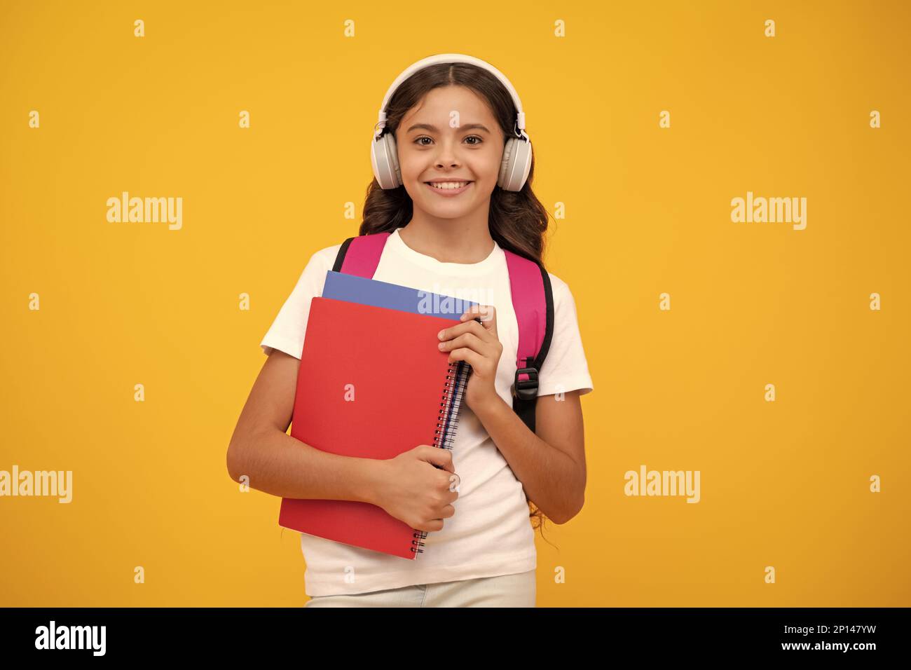 Back to school. Schoolgirl student in headphones with school bag ...