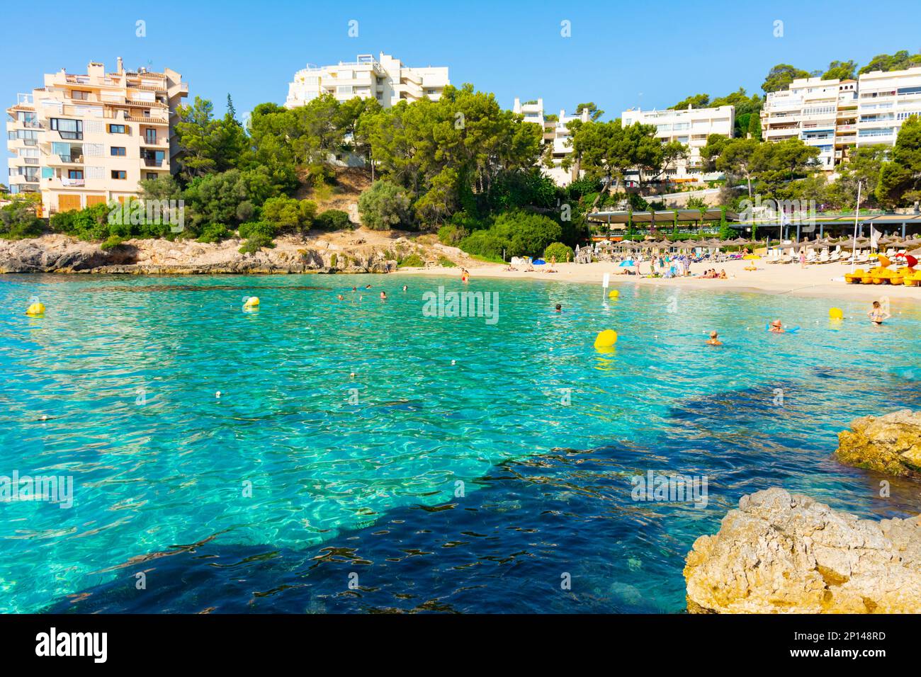 Ses Illetes, Majorca, Balearic islands, Spain. July 20th, 2022 - Terrace of the restaurant of the Balneario Illetas spa next to the beach, with umbrel Stock Photo