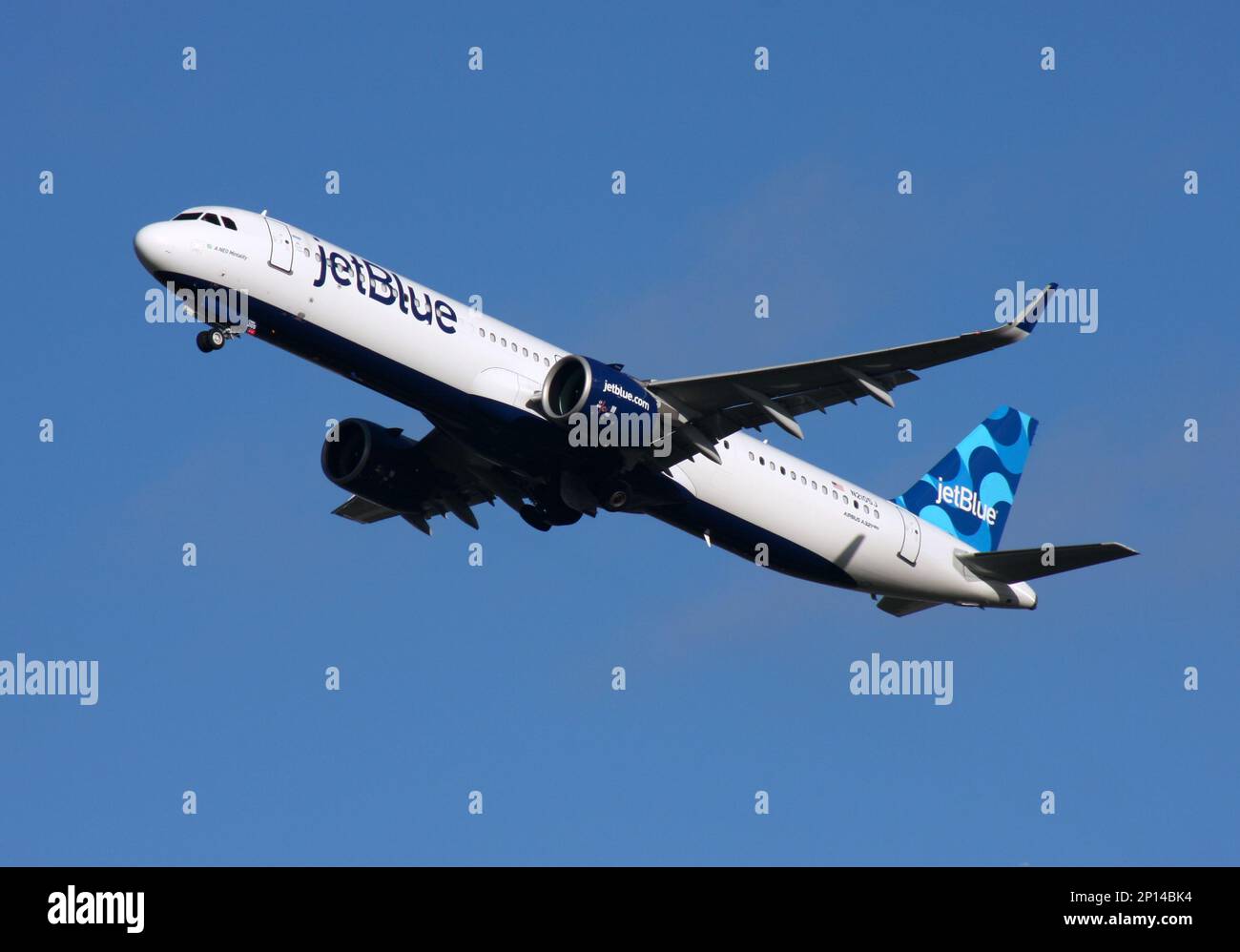 An Airbus A321neo of Jetblue Airways departs London Gatwick Airport Stock Photo