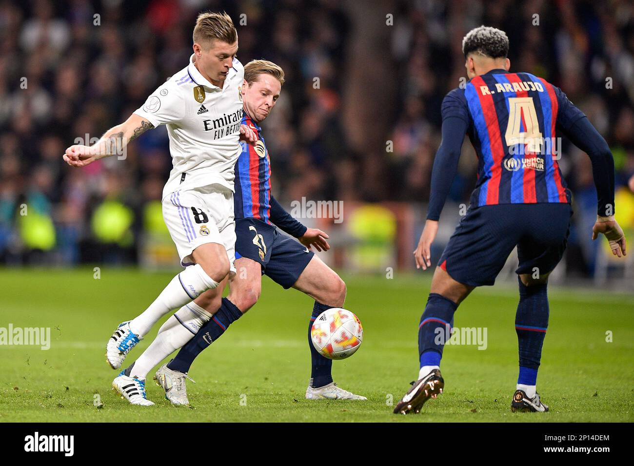 MADRID, SPAIN - MARCH 2: Toni Kroos of Real Madrid battles for the ball with Frenkie de Jong of FC Barcelona and Ronald Araujo of FC Barcelona during the Semi Final Leg One - Copa Del Rey match between Real Madrid CF and FC Barcelona at the Estadio Santiago Bernabeu on March 2, 2023 in Madrid, Spain (Photo by Pablo Morano/BSR Agency) Stock Photo
