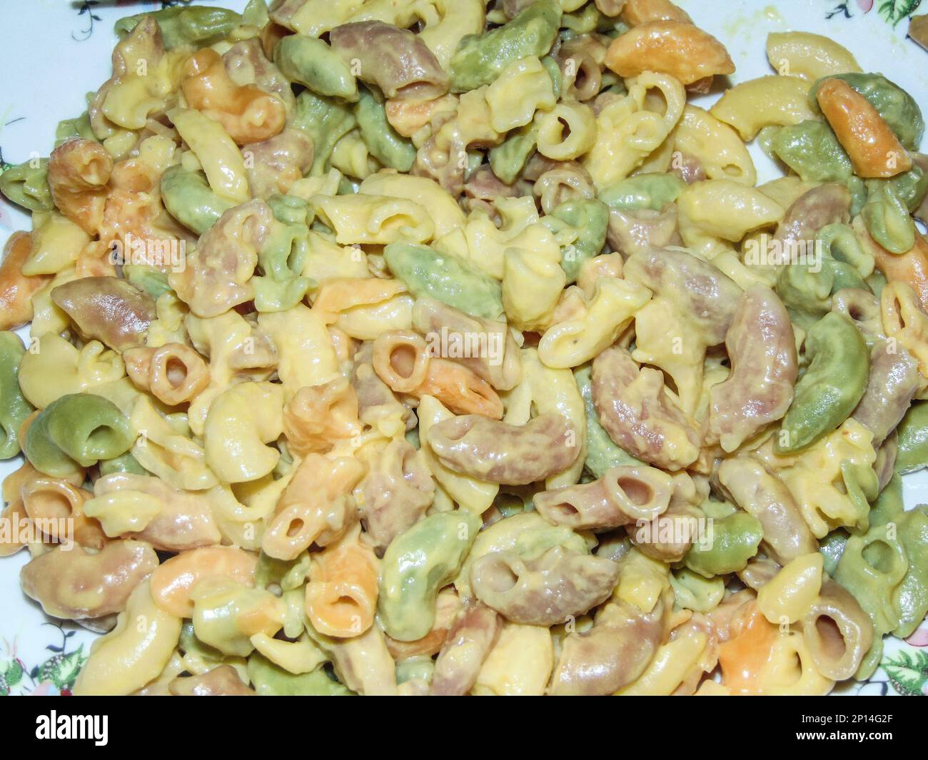 Colored pasta with parmesan and egg yolk Stock Photo Alamy