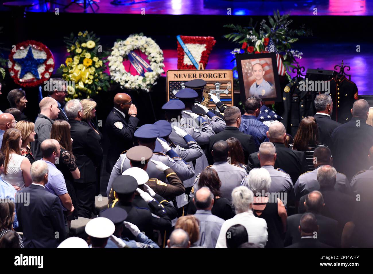 Police salute the casket during funeral services for Baton Rouge Police(00)