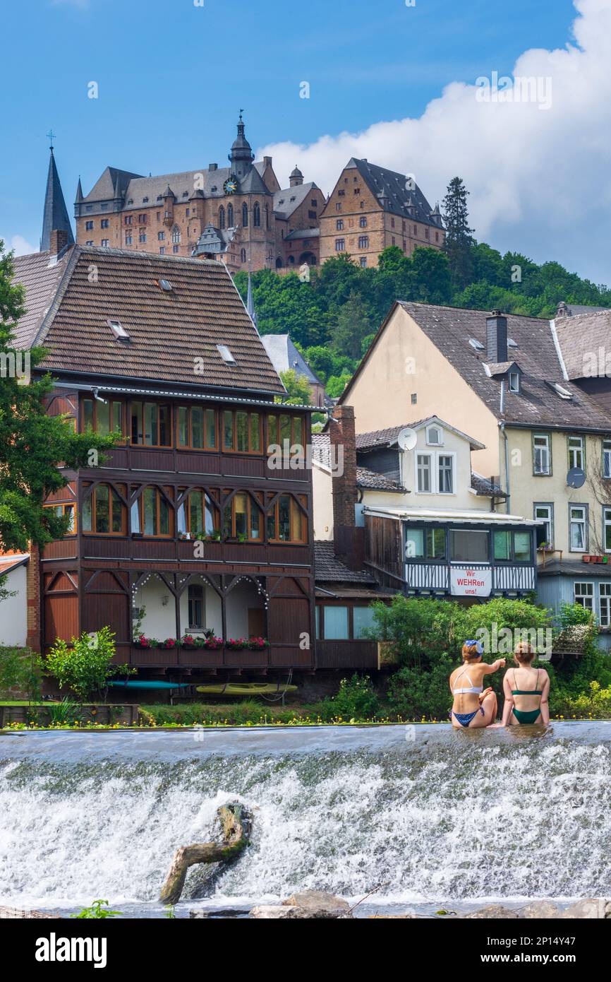 Marburg river Lahn, bather at ground sill, houses, castle Marburger Schloss, Old Town in
