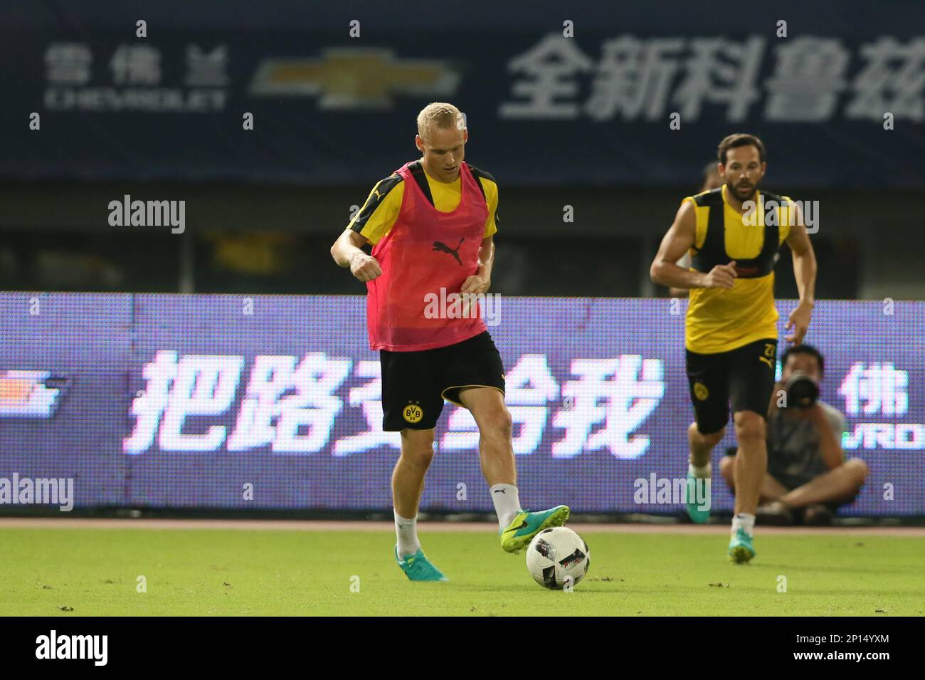 Sebastian Rode, left, and teammates of Borussia Dortmund practise during a  training session for the Shanghai