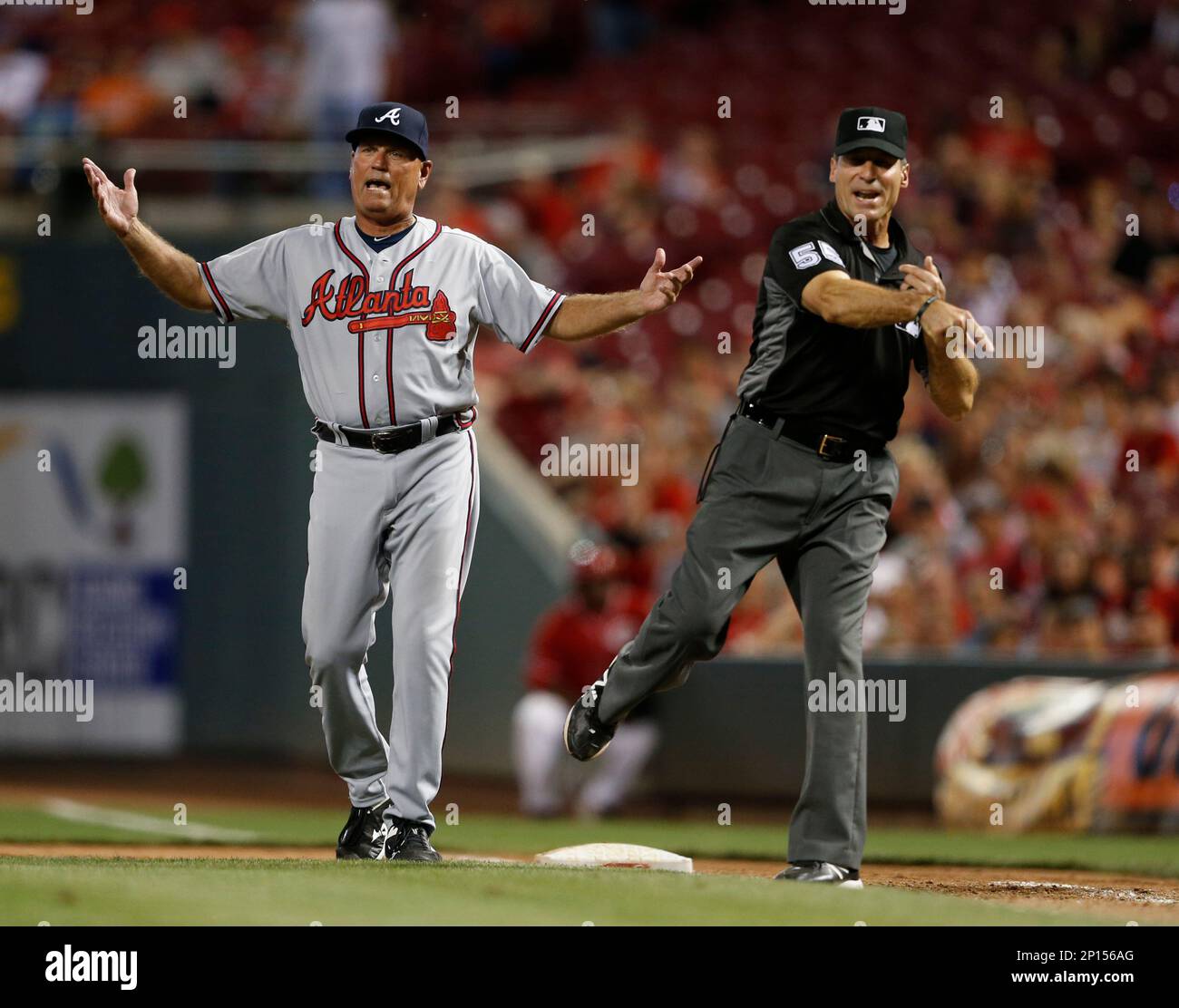 Atlanta Braves interim Manager Brian Snitker, left, reacts as he is