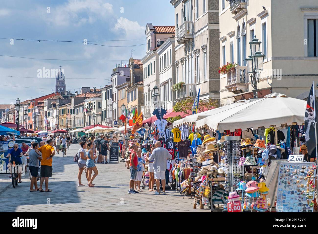 Tourists and gift shops / souvenir shops in the town Chioggia on small island at entrance to Venetian Lagoon near Venice, Veneto, Northern Italy Stock Photo