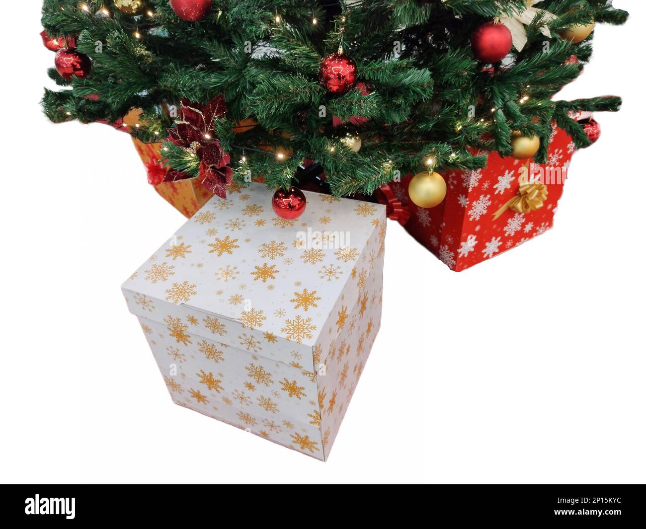 Christmas tree and gift boxes next to it Stock Photo