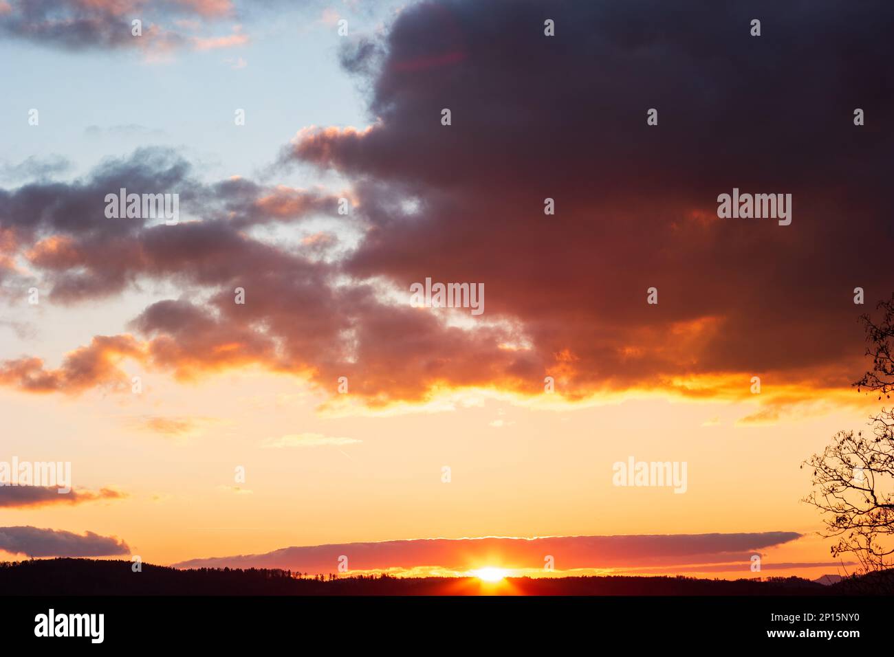 Dramatic blue sky during sunset blue pink and dark violet clouds. Stock Photo