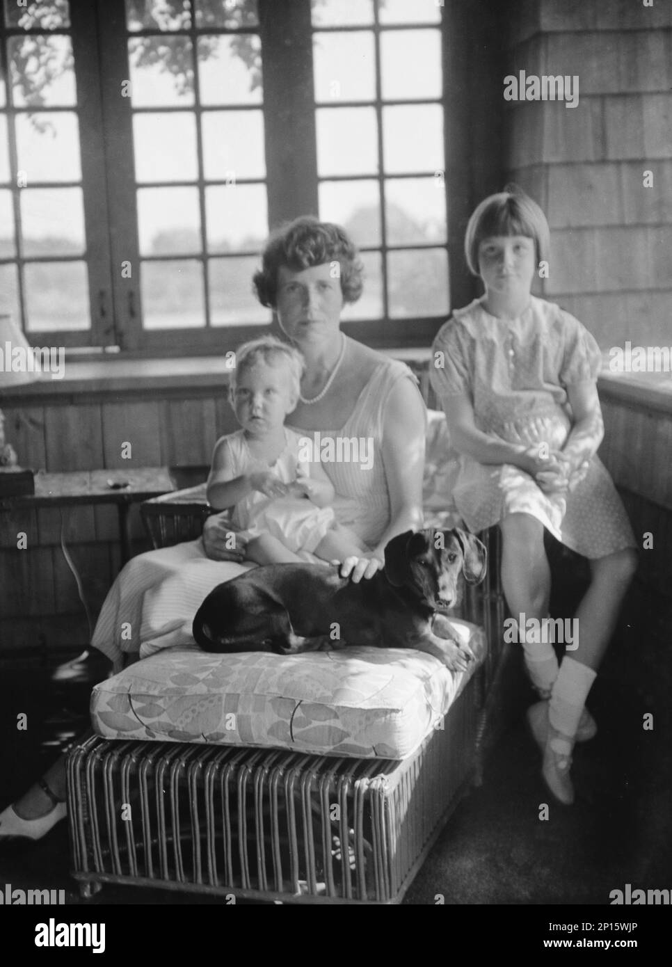Mrs. Eustis and children, with dog, portrait photograph, between