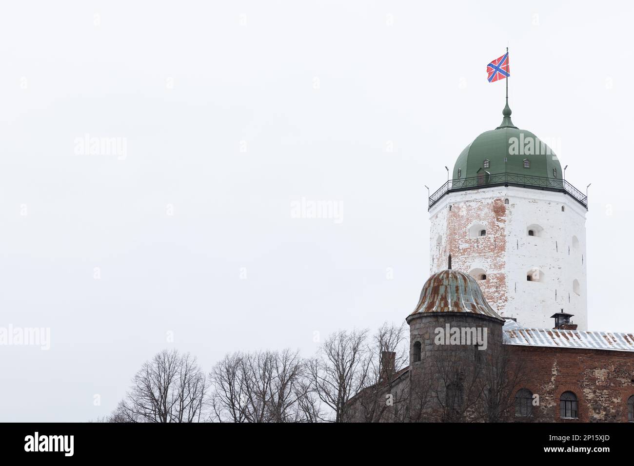 White tower of Vyborg Castle under blue sky on a winter day. Russia Stock Photo