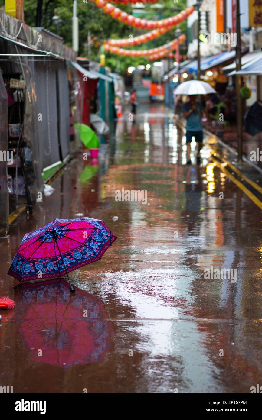 Colorful Umbrellas are Left Outside of Shops During Heavy Rains
