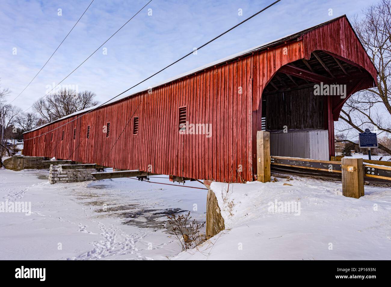 North of Kitchener, Ontario, the West Montrose Covered Bridge (also known as the Kissing Bridge) is one of the oldest of its kind in Canada. Stock Photo
