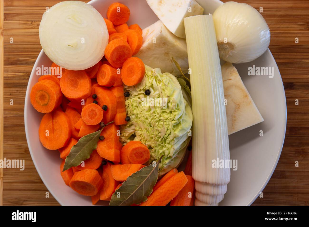 Soup stock vegetables ready cut in a plate top view. Stock Photo