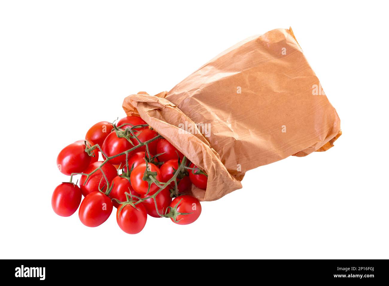 Cluster cherry tomatoes coming out from a brown paper bag, isolated on white with clipping path included Stock Photo
