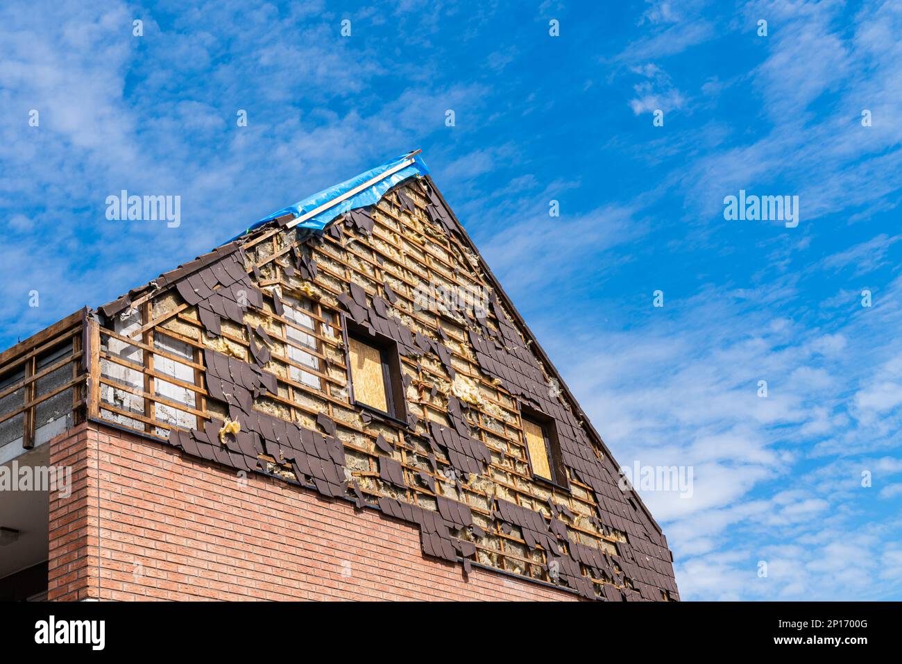 Broken house roof in need of repair. Tiled roof of a residential building Stock Photo Alamy