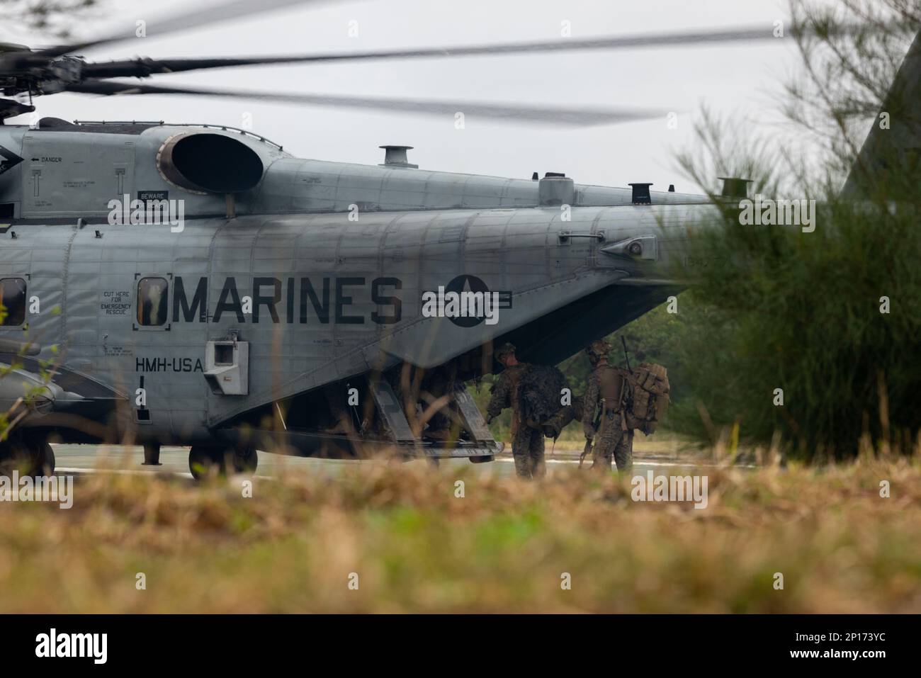 U.S. Marines with 3rd Battalion, 4th Marines board a CH-53E Super Stallion during Jungle Warfare Exercise 23 at Camp Schwab, Okinawa, Japan, Feb. 14, 2023. JWX 23 is a large-scale field training exercise focused on leveraging the integrated capabilities of joint and allied partners to strengthen all-domain awareness, maneuvers, and fires across a distributed maritime environment. Stock Photo