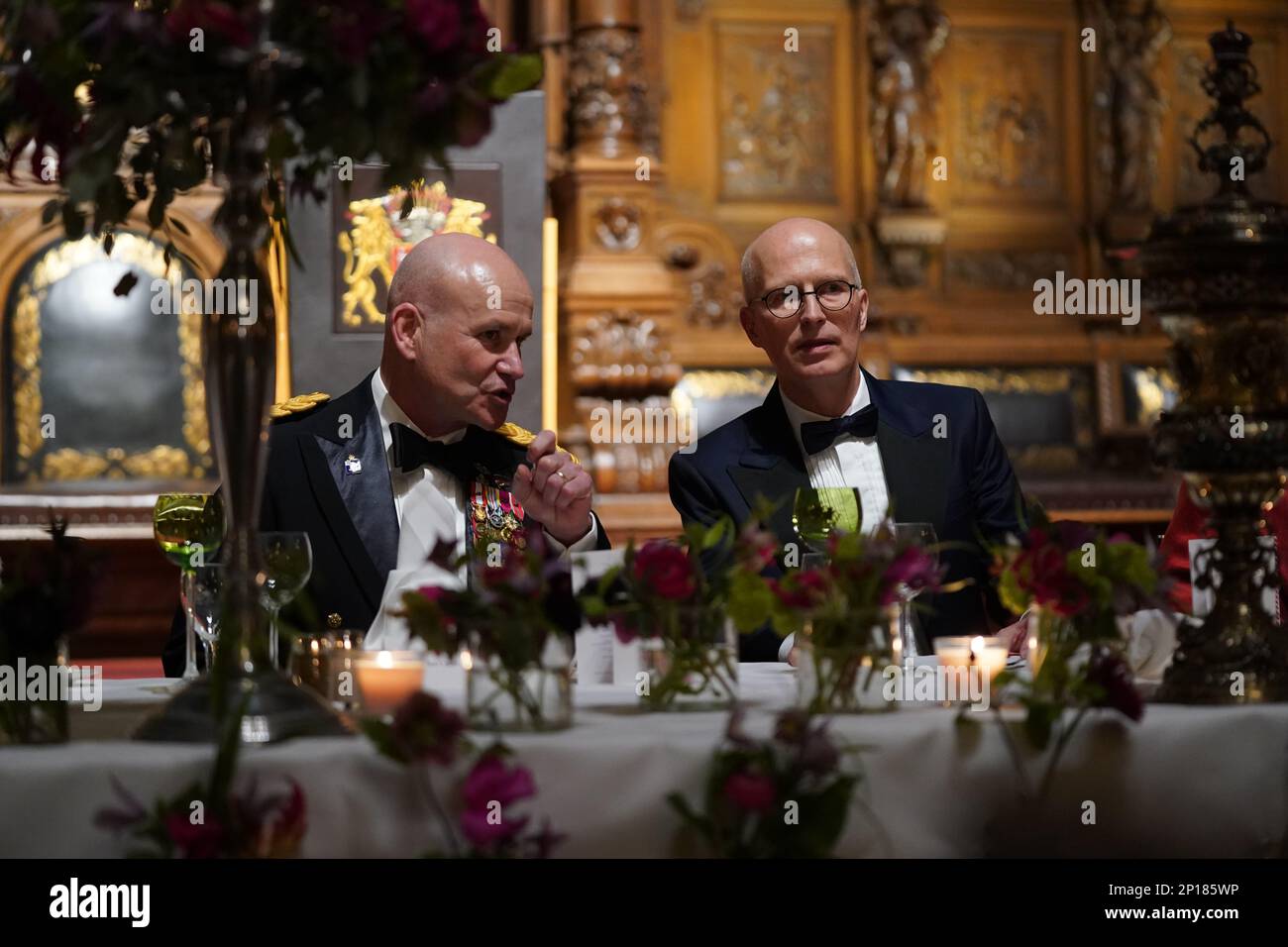 Hamburg, Germany. 03rd Mar, 2023. Peter Tschentscher (r, SPD), First Mayor and President of the Senate of the Free and Hanseatic City of Hamburg, and U.S. General Christopher Cavoli, Commander-in-Chief of the North Atlantic Treaty Organization (NATO), talk at the traditional Matthiae meal of the Hamburg Senate in the City Hall. The Matthiae-Mahl is considered the oldest guest banquet still celebrated in the world. Credit: Marcus Brandt/dpa/Alamy Live News Stock Photo