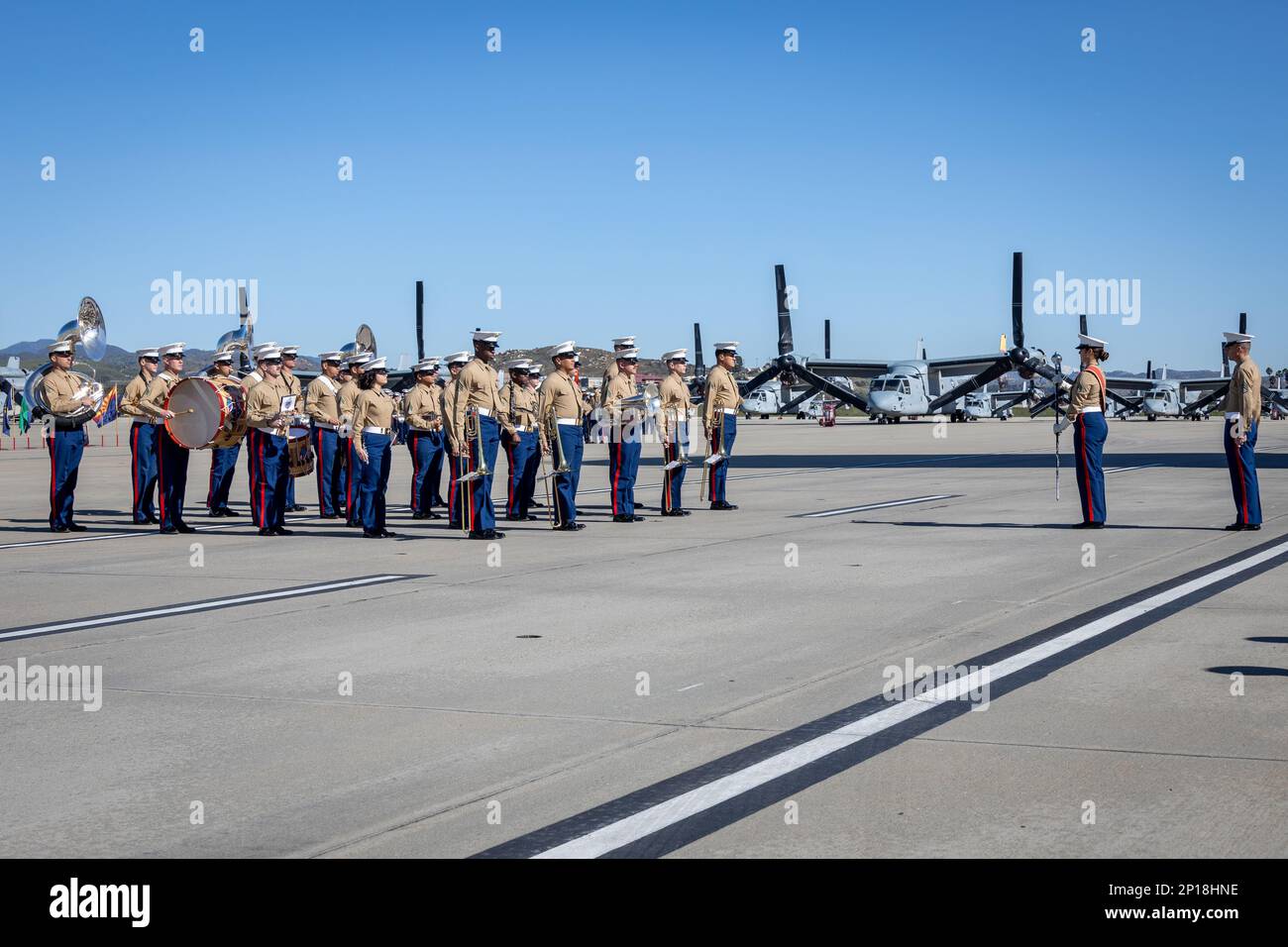 U.S. Marines with the 1st Marine Division Band stand at attention during a relief and appointment ceremony on Marine Corps Air Station Camp Pendleton, California, Feb. 15, 2023. During the ceremony Sgt. Maj. David Gonzalez, the outgoing sergeant major for Headquarters and Headquarters Squadron, MCAS Camp Pendleton, relinquished his duties to Sgt. Maj. Robert Catching. Stock Photo