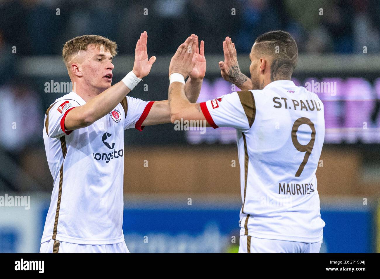 Paderborn, Germany. 03rd Mar, 2023. Soccer: 2. Bundesliga, SC Paderborn 07  - FC St. Pauli, Matchday 23, Home Deluxe Arena: St. Pauli's David Otto (l)  and St. Pauli's Maurides are happy after