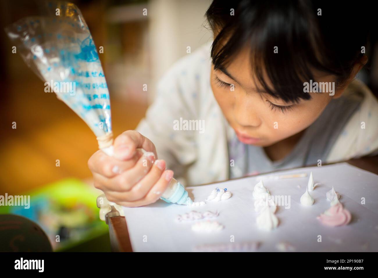 Girls making craft cakes using silicone paste Stock Photo