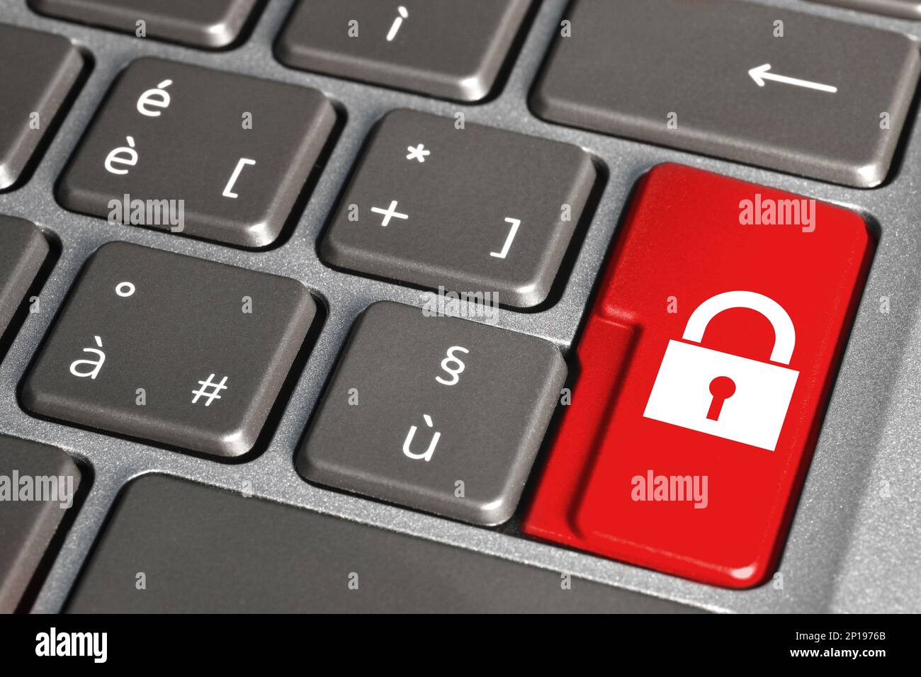 Red security button on the keyboard. Padlock symbol on red button of the Keyboard. Stock Photo