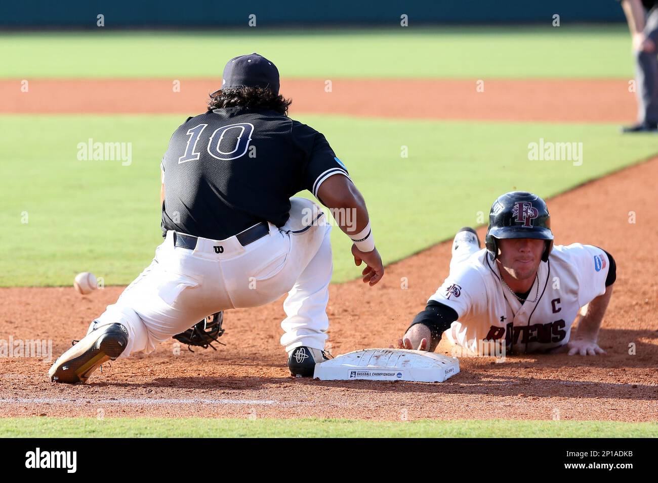 28 May 2016: Franklin Pierce's Justin Brock (right) beats the pickoff tag  from Nova Southeastern's Andres Visbal (10) back to first base. The Nova  Southeastern University Sharks played the Franklin Pierce University