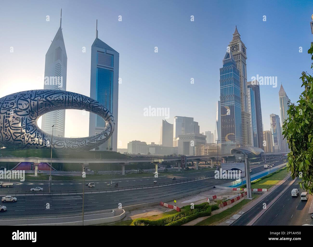 Dubai, UAE - November 27, 2021: Panoramic view of Museum of Future and Emirates towers buildings. Modern futuristic Museum built according designed by architect Shaun Killa. Stock Photo