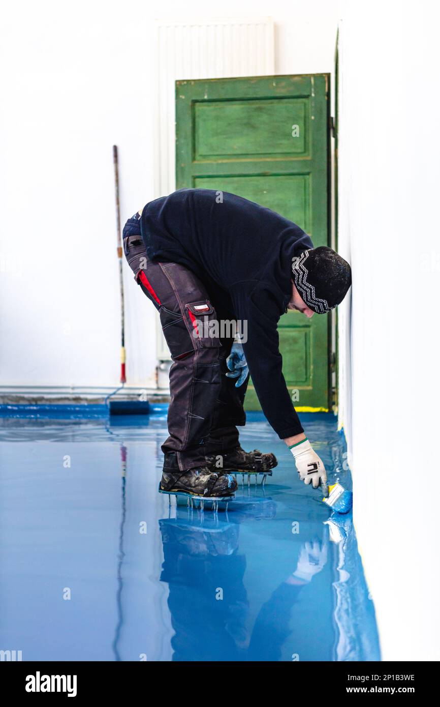 Self leveling blue epoxy floor in the gym Stock Photo