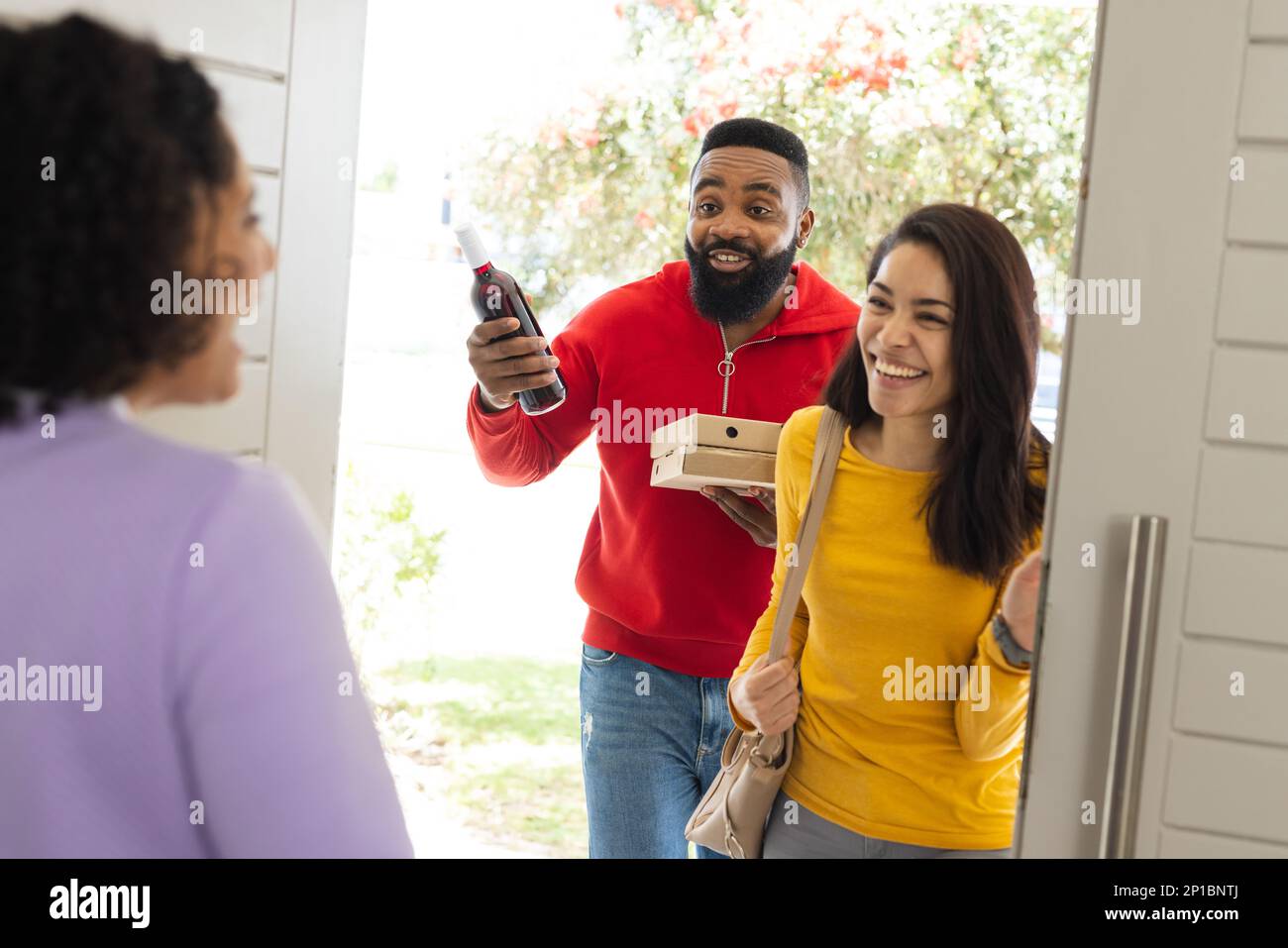 Greeting friend at the door hi-res stock photography and images - Alamy