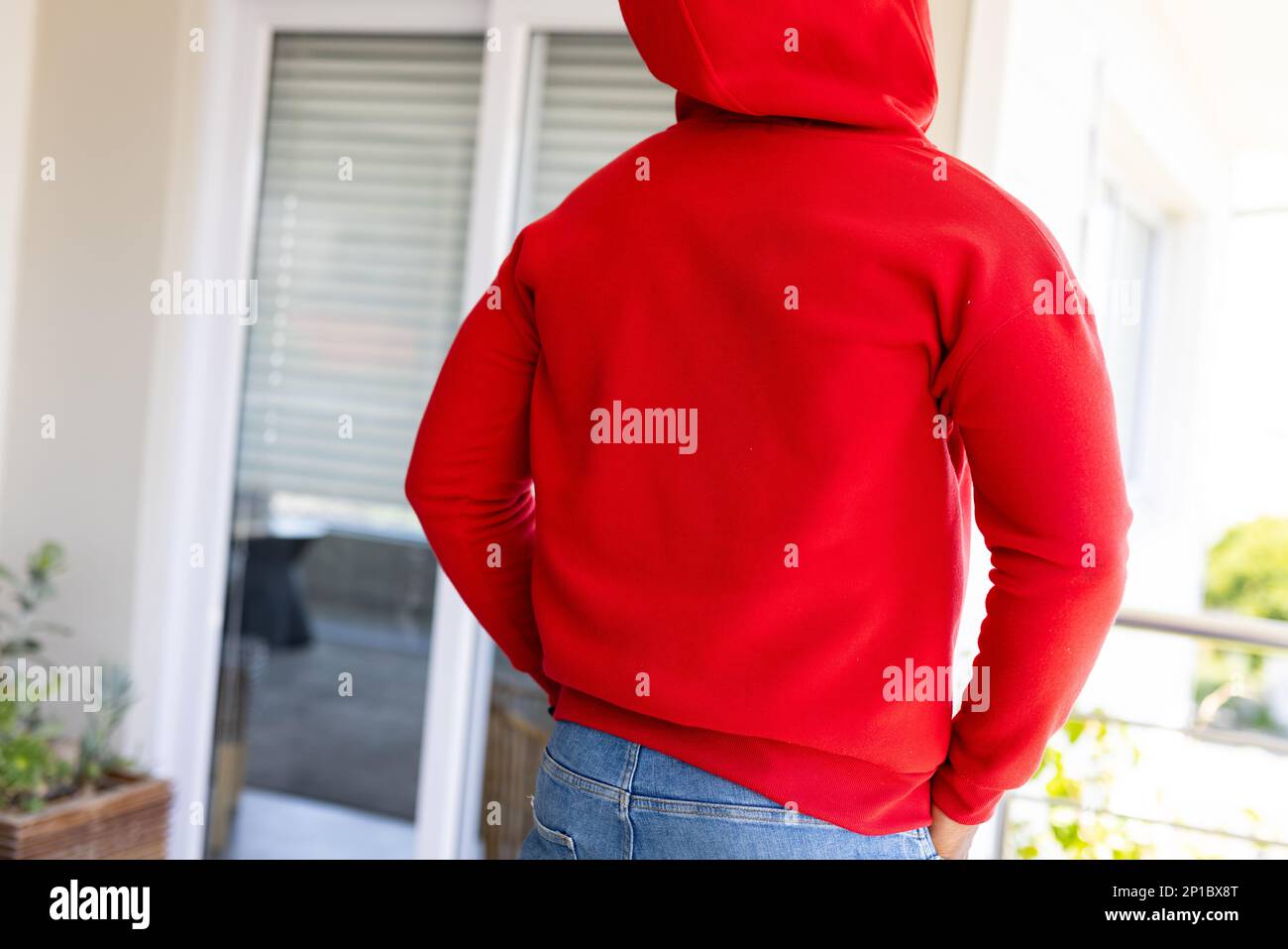 African american man wearing red sweatshirt with copy space Stock Photo