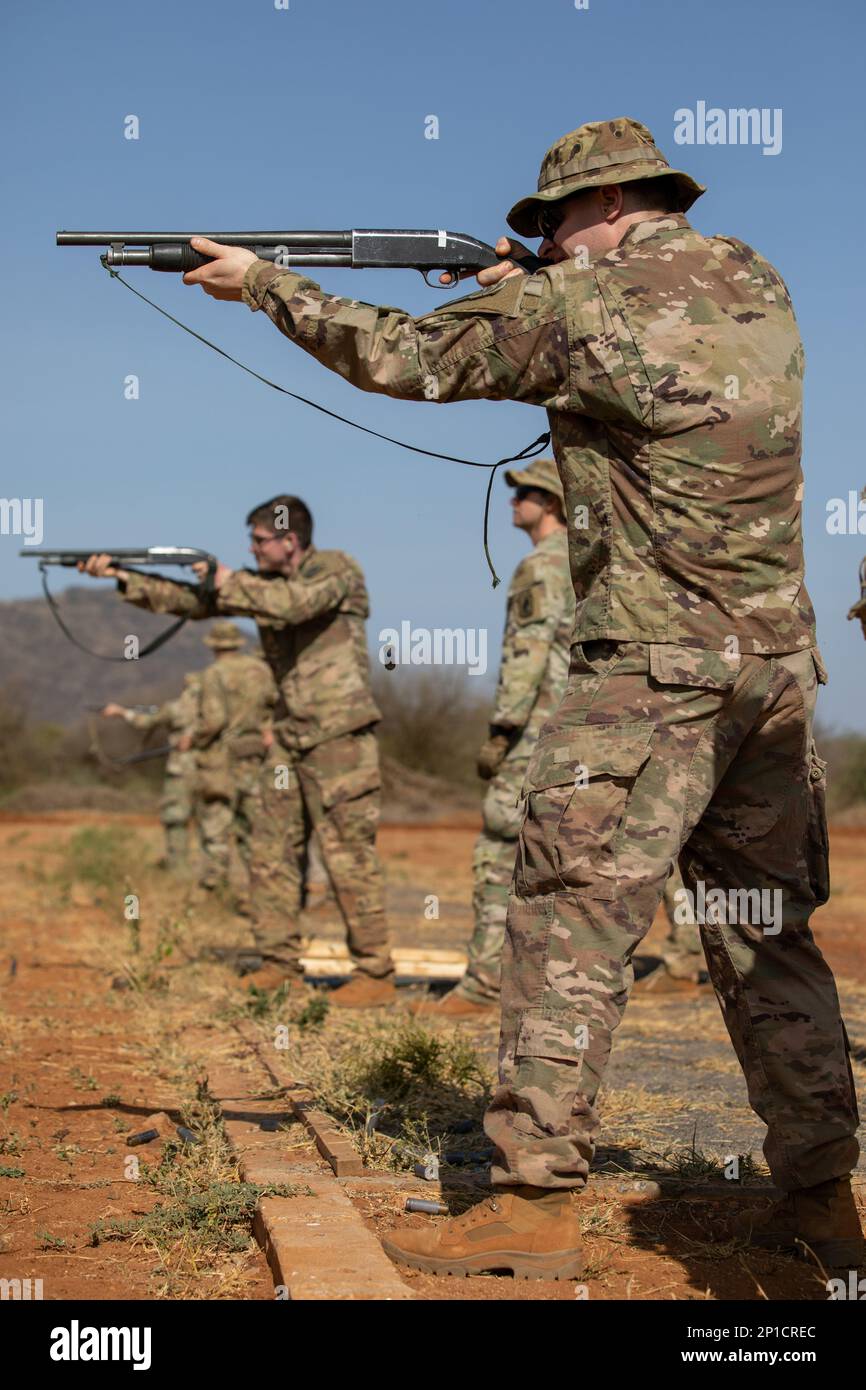 U.S. Army paratroopers, assigned to Chosen Company, 2nd Battalion, 503rd Parachute Infantry Regiment, 173rd Airborne Brigade, shoot an M500 shotgun during exercise Justified Accord 23 in Isiolo Kenya on Feb. 14, 2023. Justified Accord is U.S. Africa Command's largest exercise in East Africa. Led by U.S. Army Southern European Task Force, Africa (SETAF-AF), this multi-national exercise brings together more than 20 countries from four continents to increase partner readiness for peacekeeping missions, crisis response and humanitarian assistance. Stock Photo