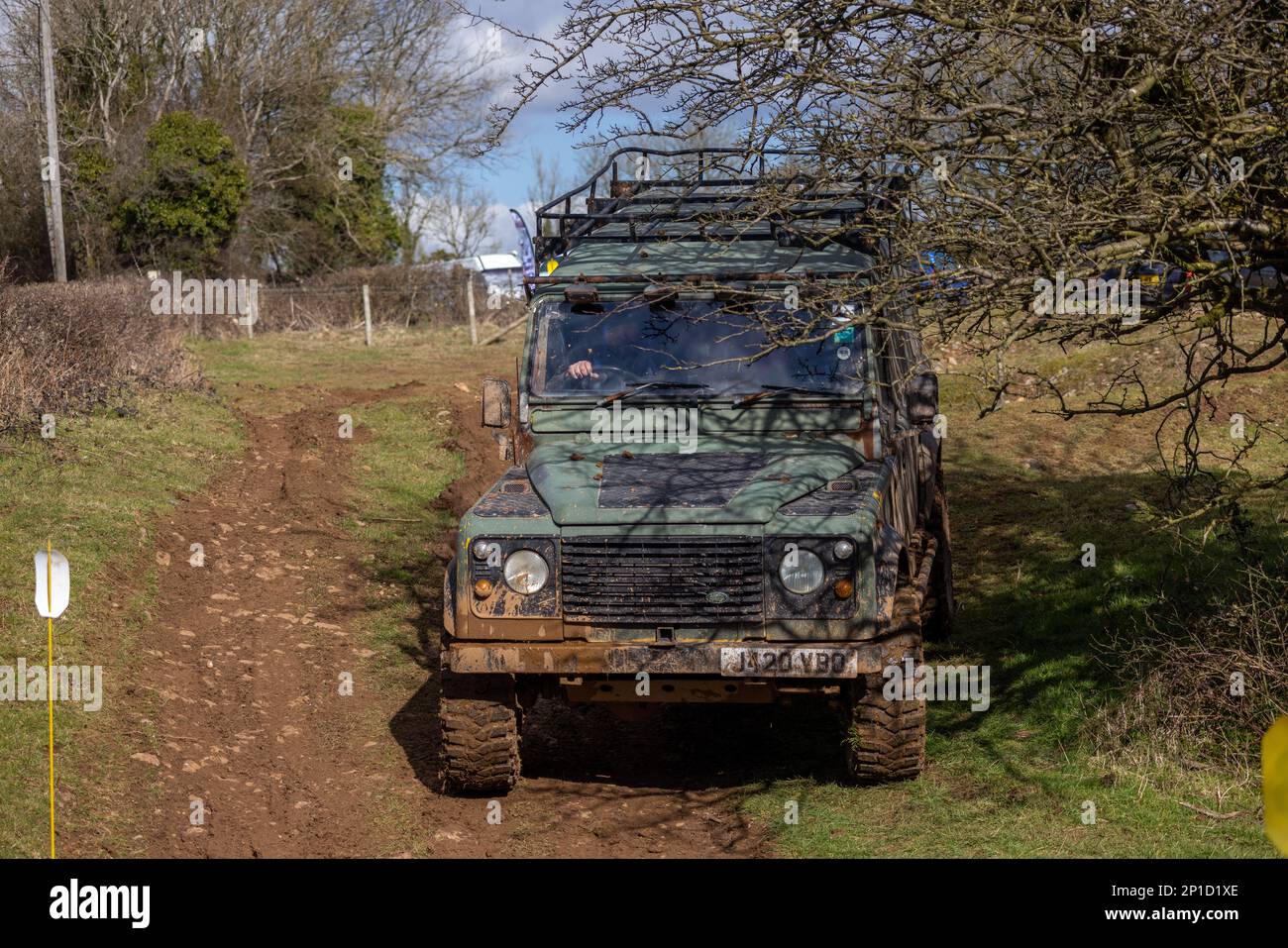 February 2023 - Land Rover Defender 90 taking part in an ADWC off road trial at Chewton Mendip in Somerset, UK. Stock Photo