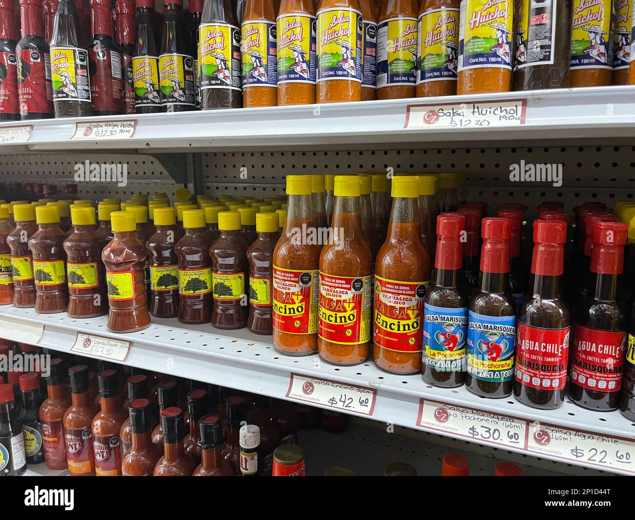 Bottled sauces for sale on shelves at the Municipal Market in the shopping quarter of Hermosillo, Mexico Stock Photo