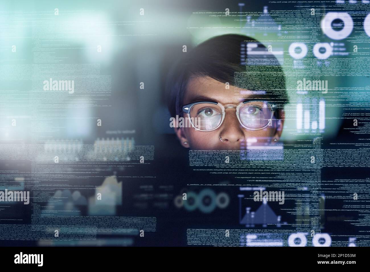 Shes a genius programmer. Cropped shot of a young computer programmer looking through data. Stock Photo