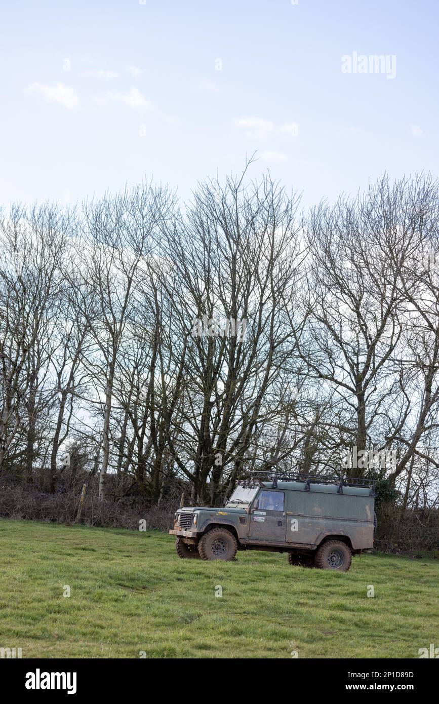 February 2023 - Land Rover Defender 90 taking part in an ADWC off road trial at Chewton Mendip in Somerset, UK. Stock Photo