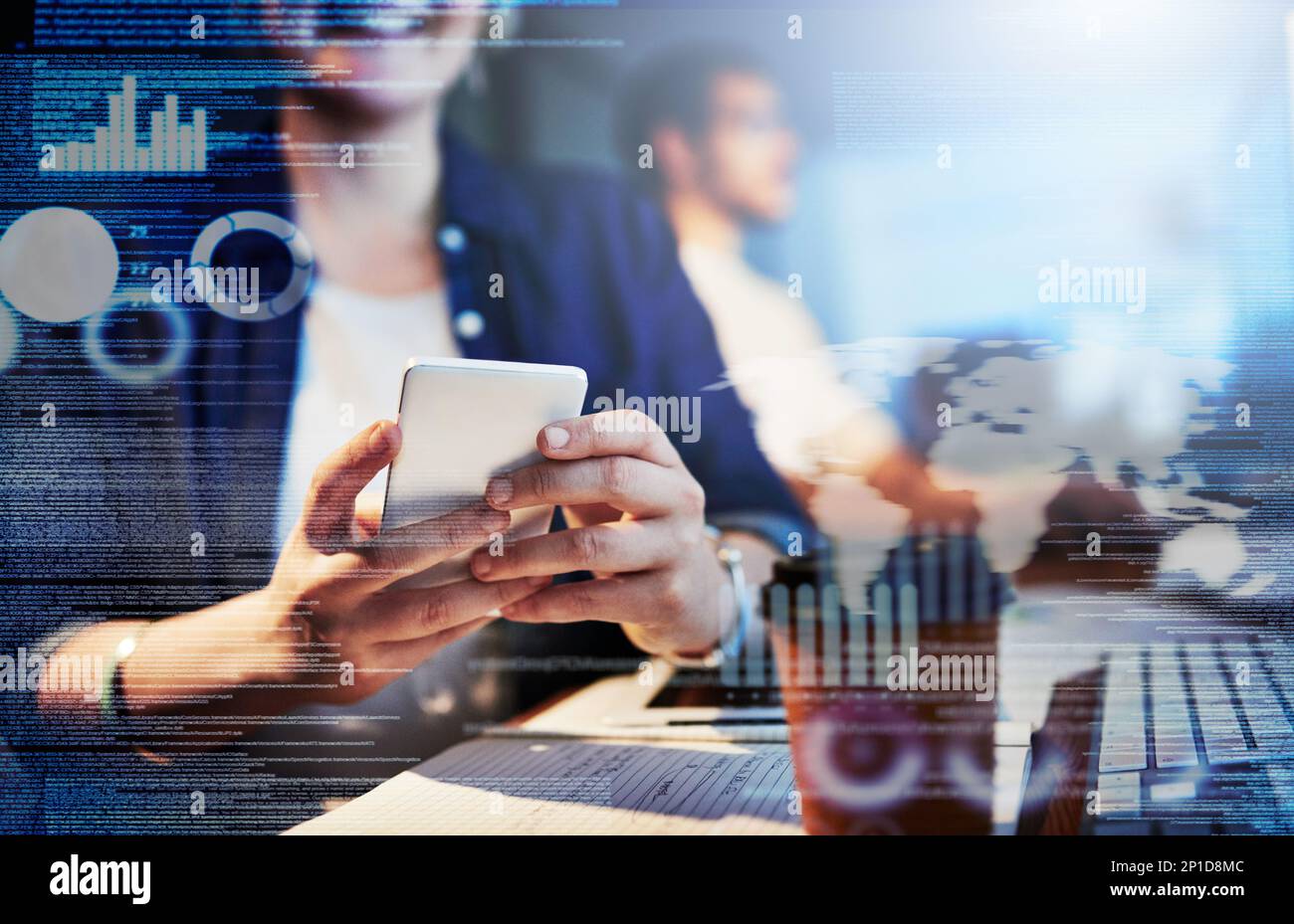 Testing the code on her smartphone. Cropped shot of computer programmers working on new code. Stock Photo