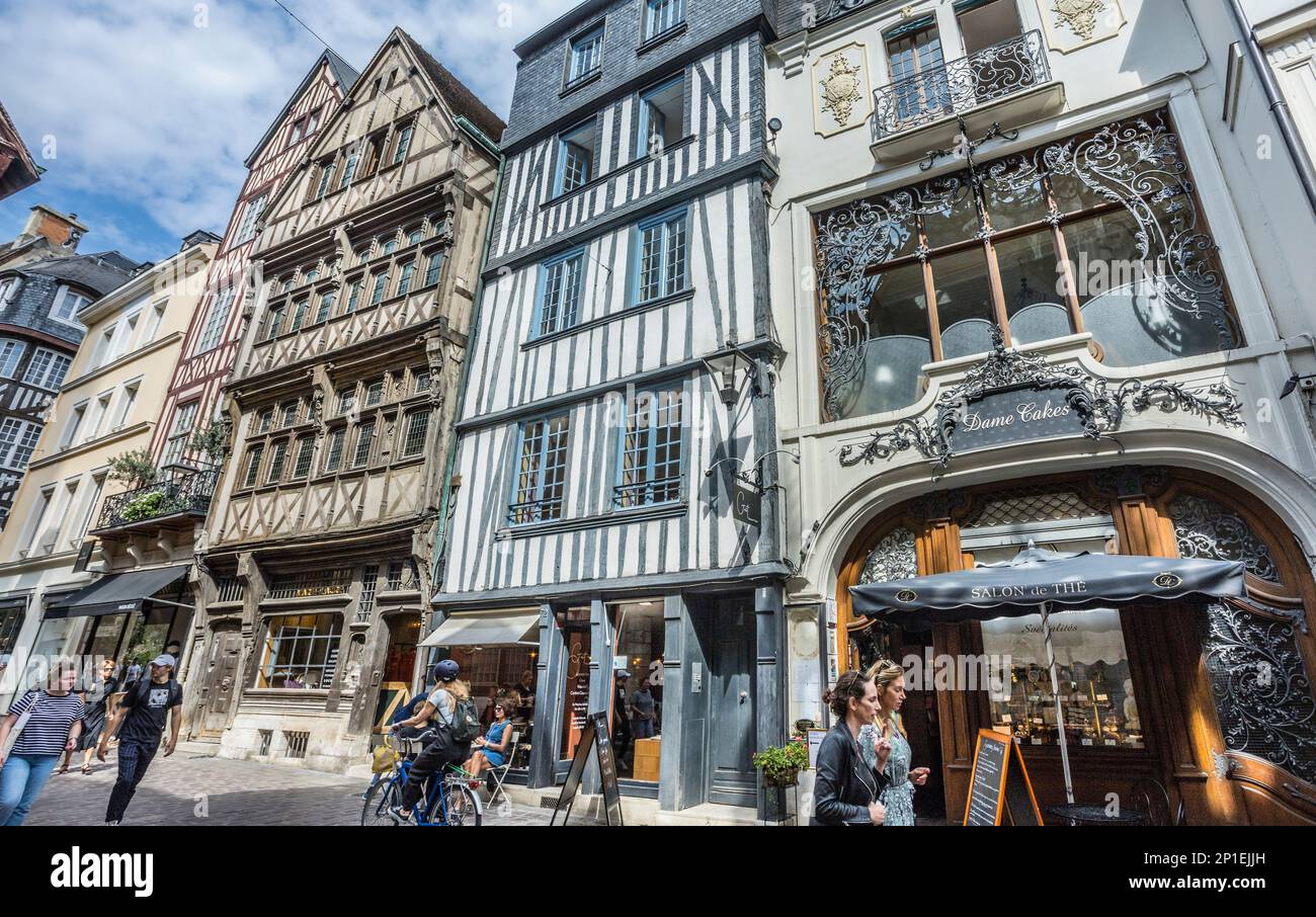 historic buildings lining the narrow, cobblestone paved Rue Saint-Romain in the medieval centre of Rouen, Normandy, France Stock Photo
