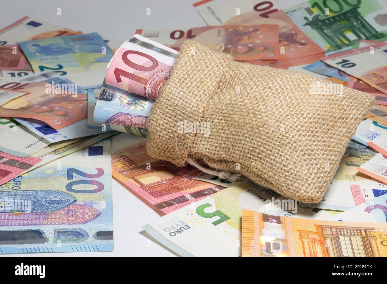 bag full of money. scattered banknotes Stock Photo Alamy