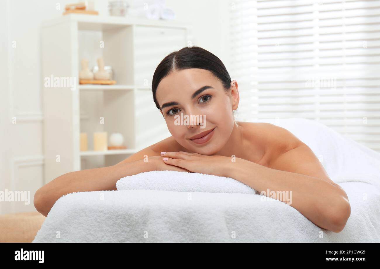 Beautiful young woman relaxing in spa salon Stock Photo - Alamy