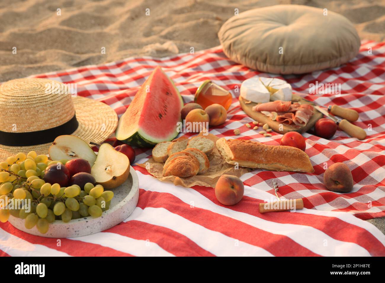 Different tasty snacks on picnic blanket outdoors Stock Photo - Alamy