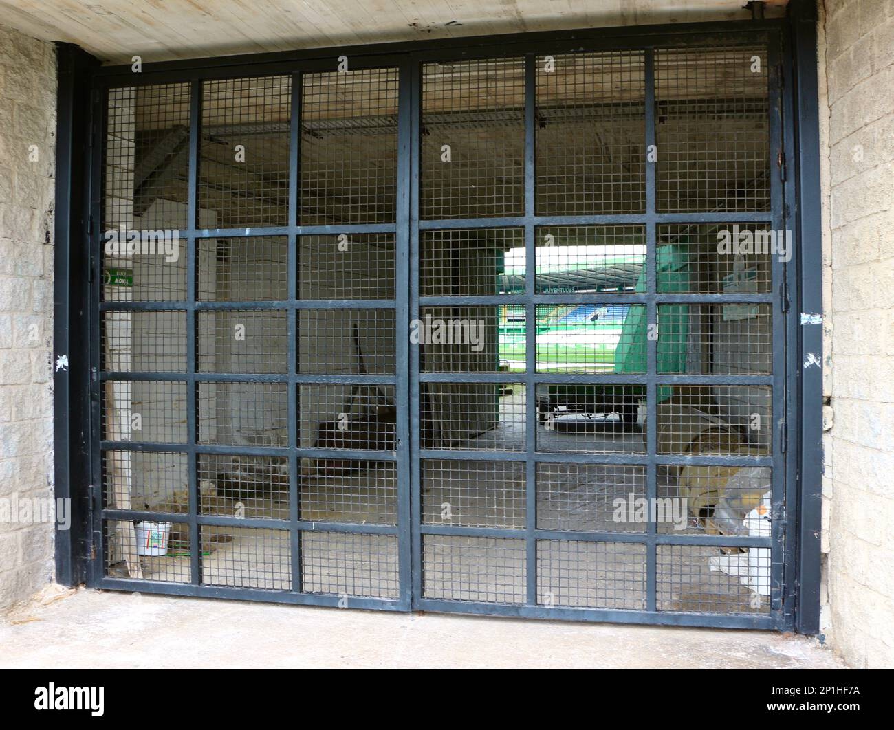 Real Racing Football Club closed stadium through a metal fence at an