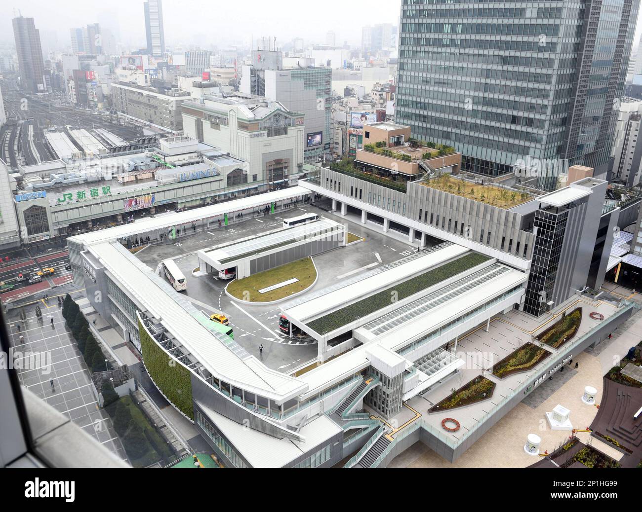 A photo shows the Shinjuku Expressway Bus Terminal, ‘Basuta Shinjuku’ which started the operations in Tokyo on April 4. Japan’s largest bus terminal, the Shinjuku Expressway Bus Terminal, has been completed at the south exit area of JR Shinjuku Station. The new terminal integrates into one area the buses that originate from Shinjuku along 19 routes across the nation. ( The Yomiuri Shimbun via AP Images ) Stock Photo