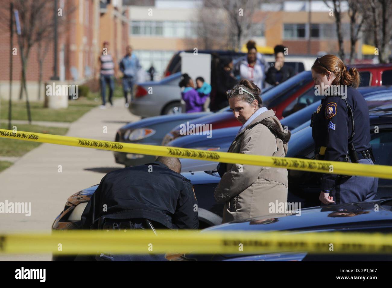 In a Friday, March 25, 2016 photo, Grand Rapids police investigate two