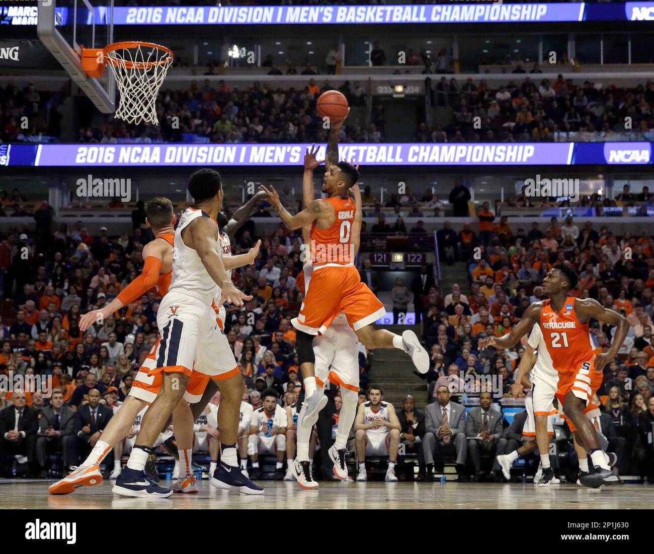 Syracuse's Michael Gbinije (0) shoots during the first half of an NCAA