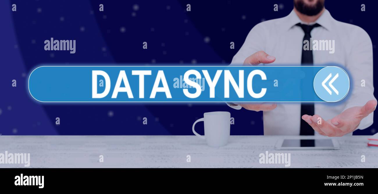 Hand writing sign Data Sync. Internet Concept data that is continuously generated by different sources Stock Photo