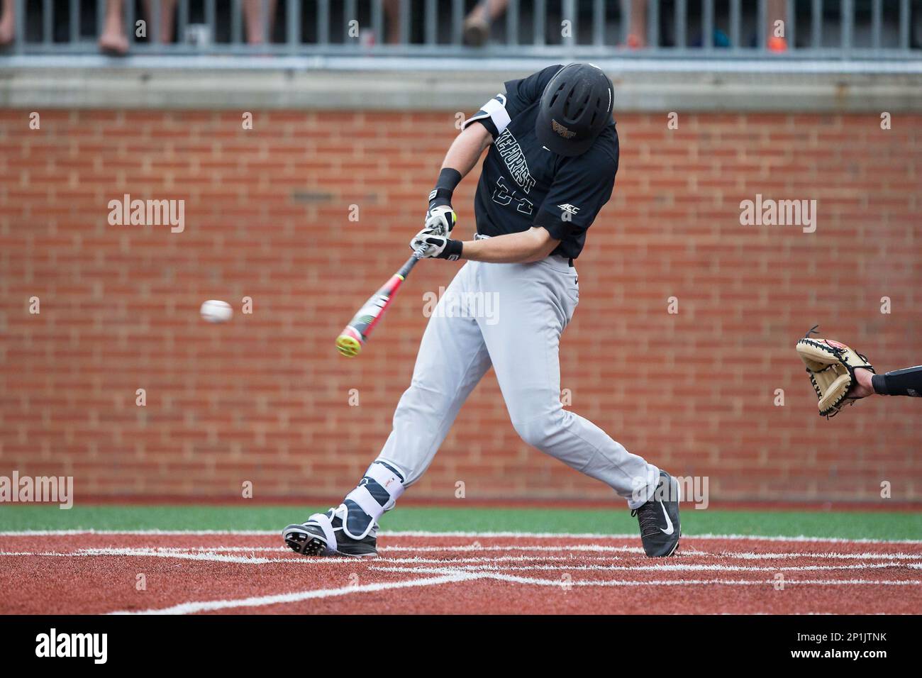 Gavin Sheets (24) of the Wake Forest Demon Deacons follows through on his  swing against the Charlotte 49ers at Hayes Stadium on March 16, 2016 in  Charlotte, North Carolina. The 49ers defeated