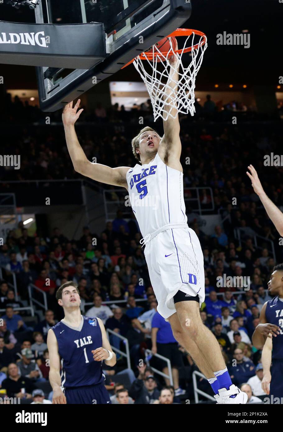 Duke's Luke Kennard (5) and Marshall Plumlee (40) double-team Yale's  Brandon Sherrod (35) during the second half in the second round of the NCAA  men's college basketball tournament in Providence, R.I., Saturday