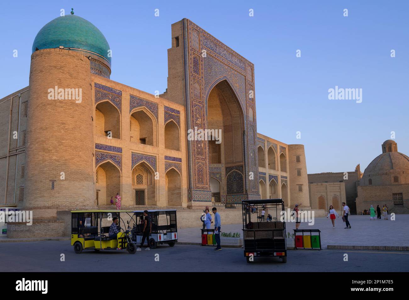 BUKHARA, UZBEKISTAN - SEPTEMBER 08, 2022: View of medieval Mir-i-Arab madrasa on evening twilight Stock Photo