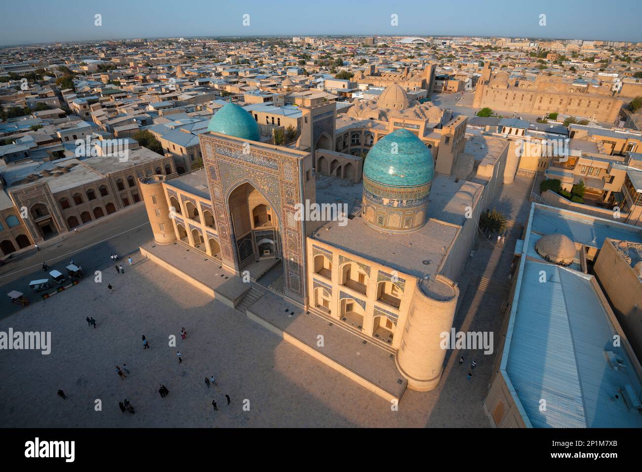 BUKHARA, UZBEKISTAN - SEPTEMBER 09, 2022: Top view of the medieval Mir-i-Arab madrasah on a sunny September evening Stock Photo